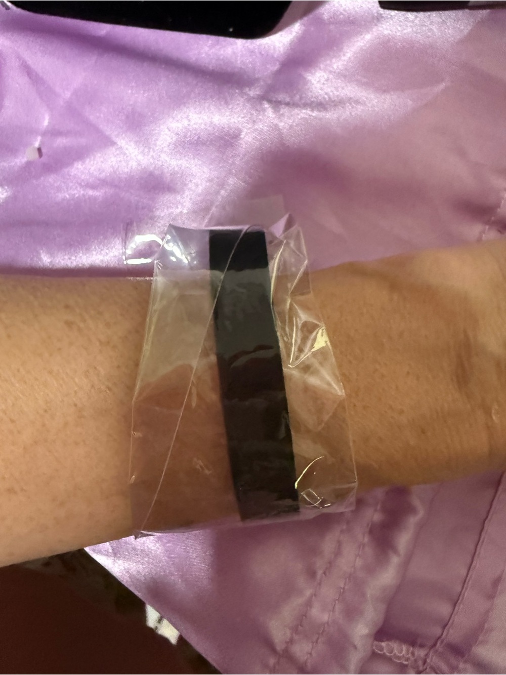 Black leather strap bracelet with gold hardware